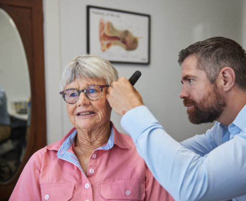 An old lady is having a hearing assessment with Sam Jones from Blackmore Audiology.
